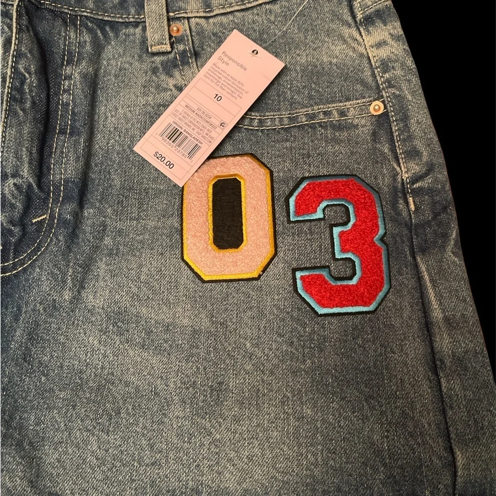 BNWT- Mini denim skirt w/ cute patches.